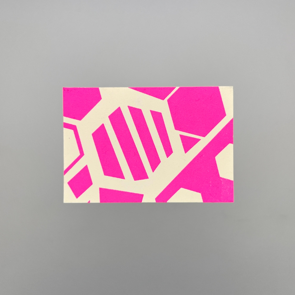 Rear of a beige business card with bright pink, almost magenta abstract and graphic shapes printed on it