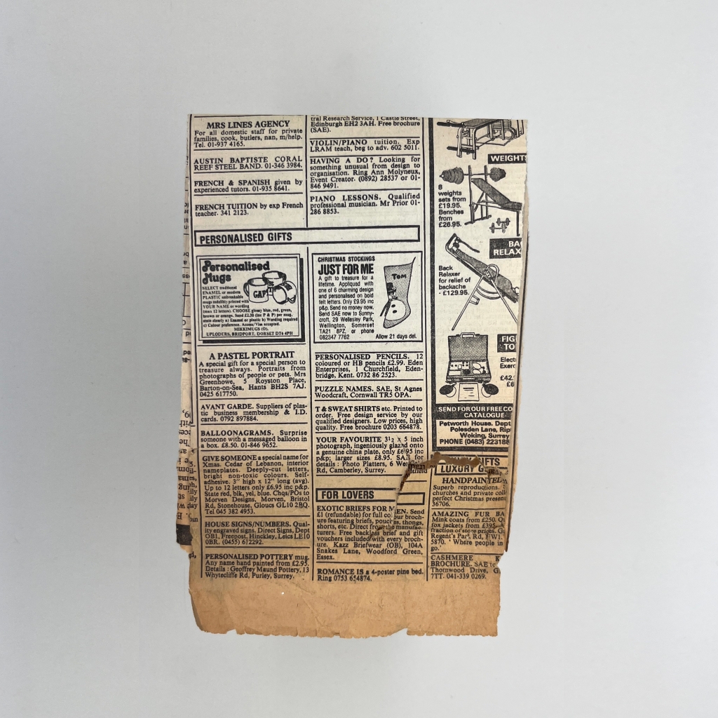 4 of 4 sides of and old piece of folded yellowing newspaper with classified adverts, with illustrations of more exercise equipment, some personalised mugs and a Christmas stocking.  